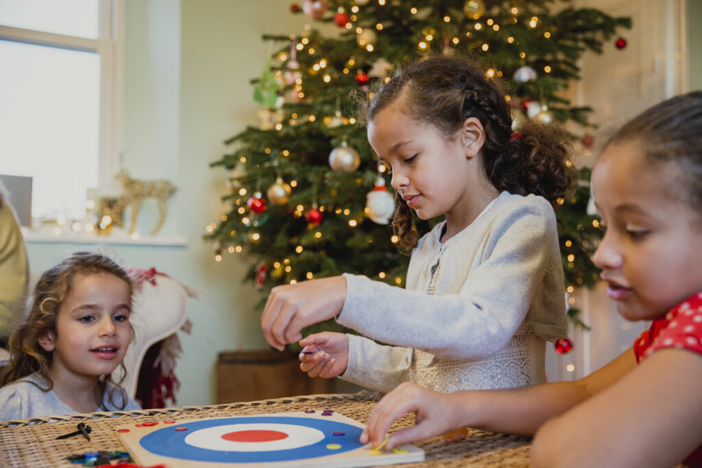 Foster Children playing a board game at Christmas